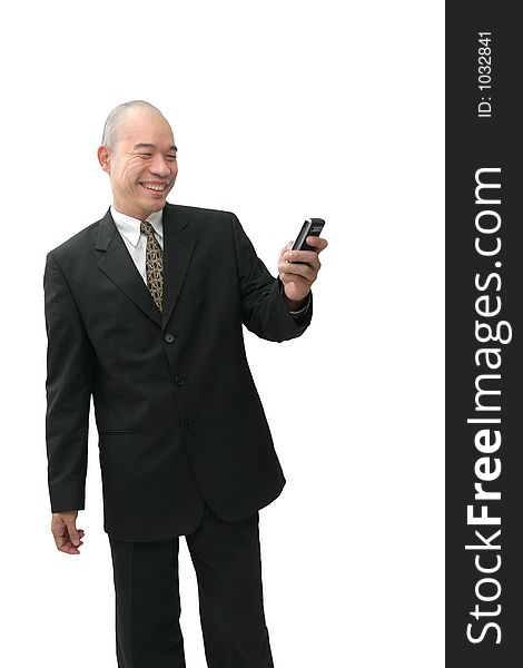 Oriental man in suit on cell phone looking happy. Oriental man in suit on cell phone looking happy