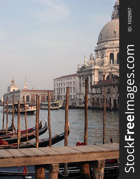 This is all of Venice encapsulated into one image: the church that lies at the mouth of the Grand Canal, bathed in late-day sun, while gondolas lined up at the water's edge seem to pay homage to it. This is all of Venice encapsulated into one image: the church that lies at the mouth of the Grand Canal, bathed in late-day sun, while gondolas lined up at the water's edge seem to pay homage to it.