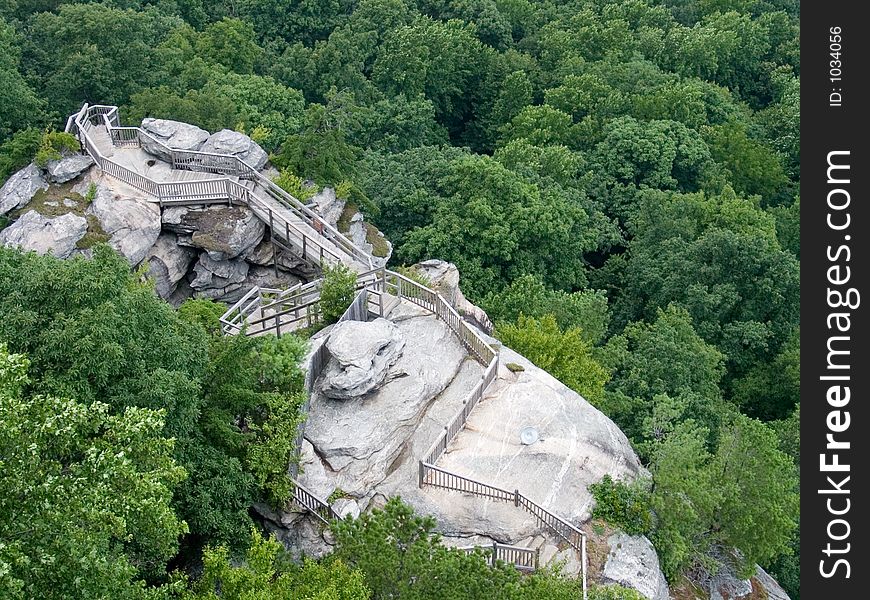 Hiking trail with stairs on rock in mountains of nc