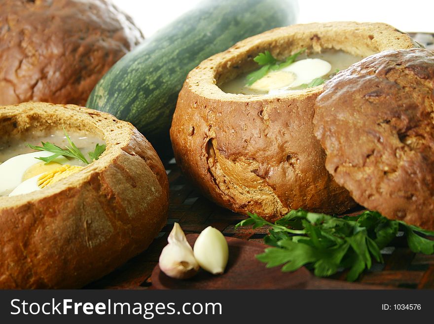 Traditional Polish soup made from fermented rye, served in bread .