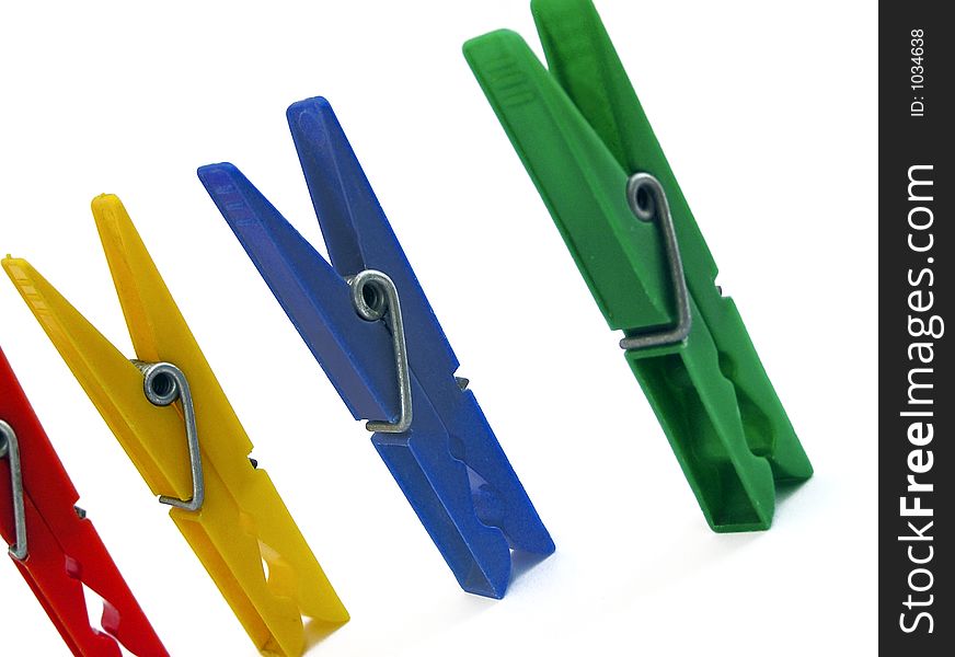 Four colourful clips to hanging washing. Four colourful clips to hanging washing