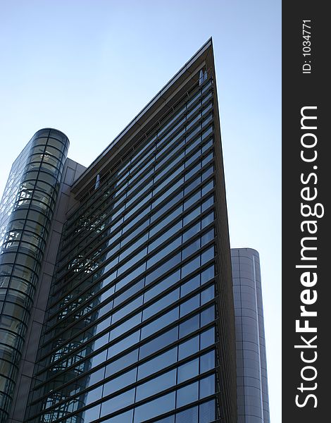 Steel and glass office block, with one sign, Leeds, West Yorkshire, England. Steel and glass office block, with one sign, Leeds, West Yorkshire, England