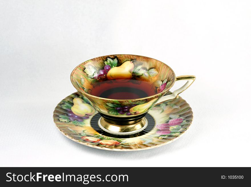 Antique teacup on white