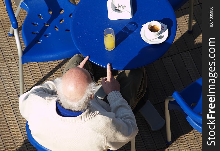 Old man enjoying the sun in the spring. Old man enjoying the sun in the spring