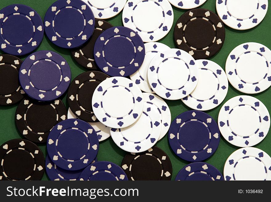 Casino Chips, Black, Blue, White on Green Background