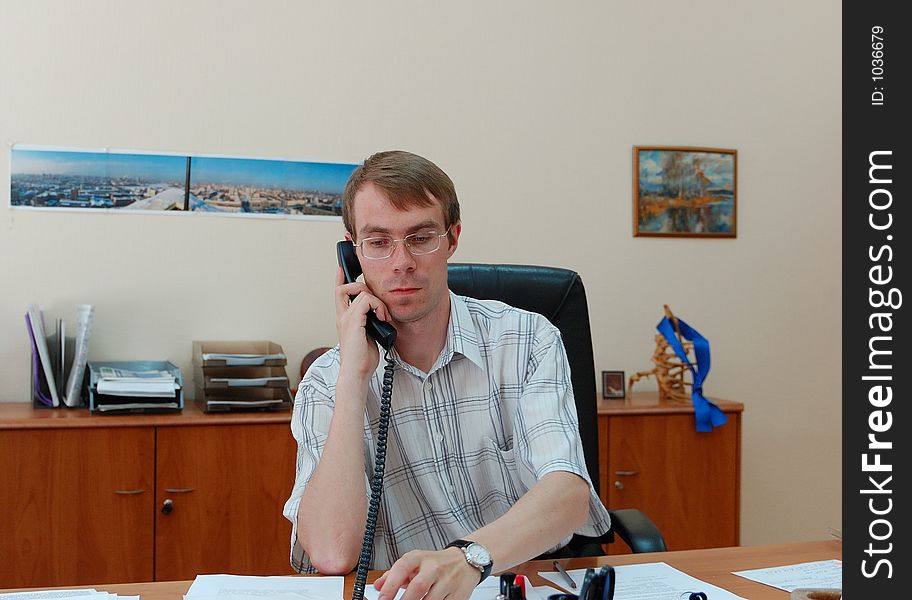 Businessman Talks On A Phone