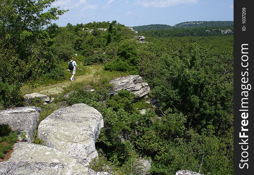 Man Hiking Via Cliff Edge