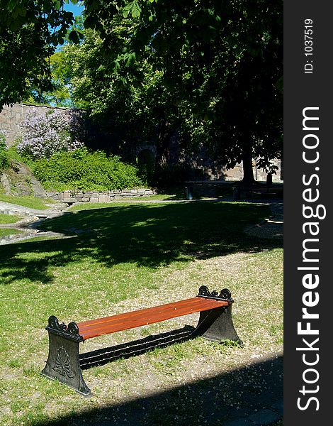 A bench in a park at Akershus fortress in Oslo, Norway.