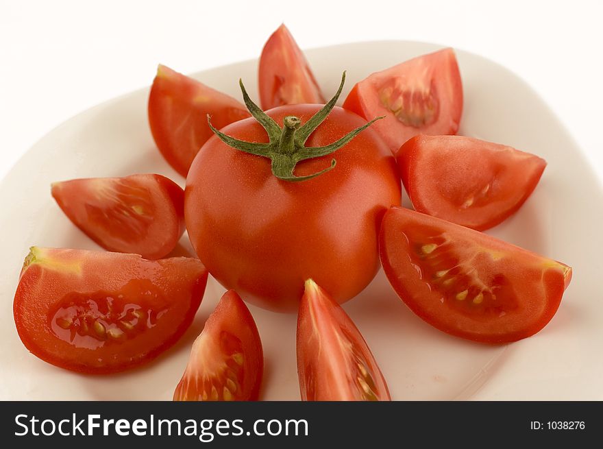 Tomato on a plate. Tomato on a plate