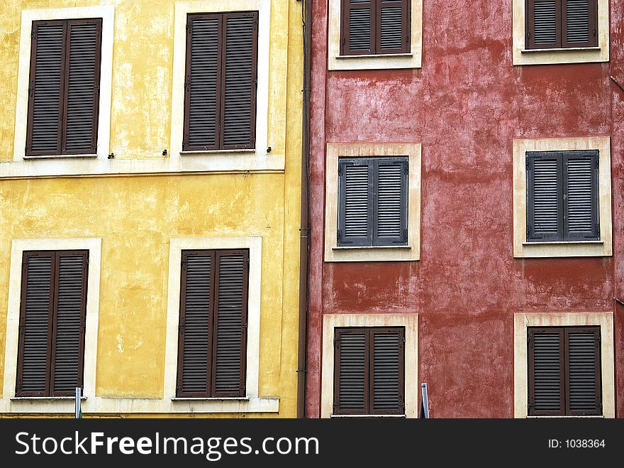 Painted houses with shutter windows in Rome, near Campo Fiori. Painted houses with shutter windows in Rome, near Campo Fiori