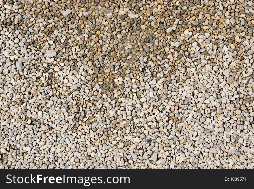 Stones on the ground, upper part is wet from water. Stones on the ground, upper part is wet from water