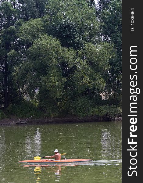 Man in a boat on a lake. Man in a boat on a lake