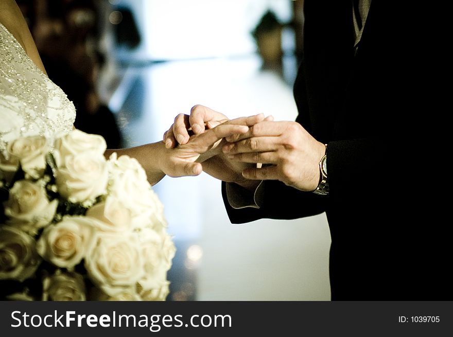 Groom and bride exchange rings
