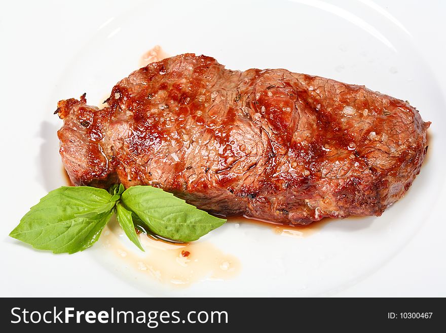 Juicy beef steak on the white plate