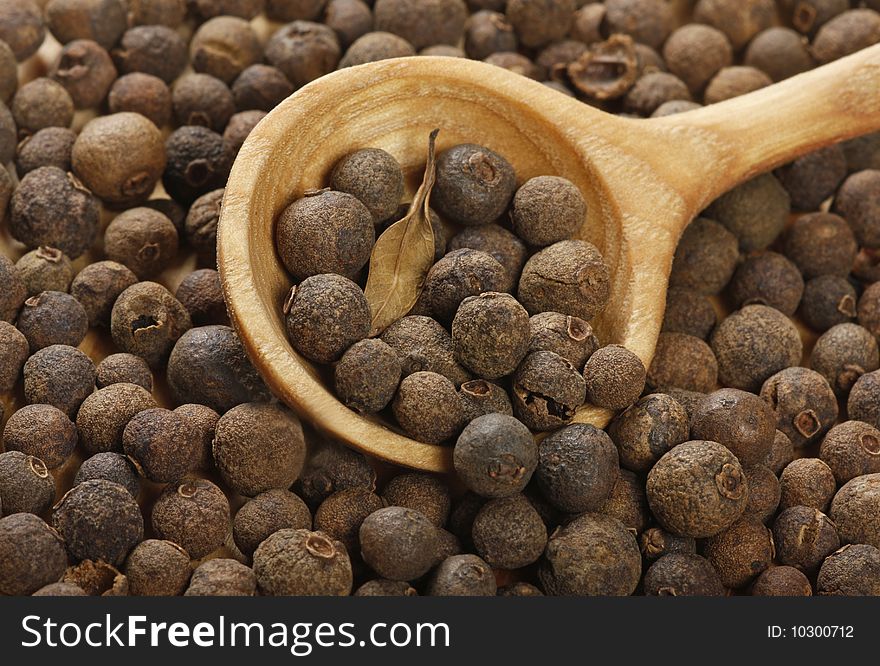 Aromatic pepper in wooden spoon. Aromatic pepper in wooden spoon