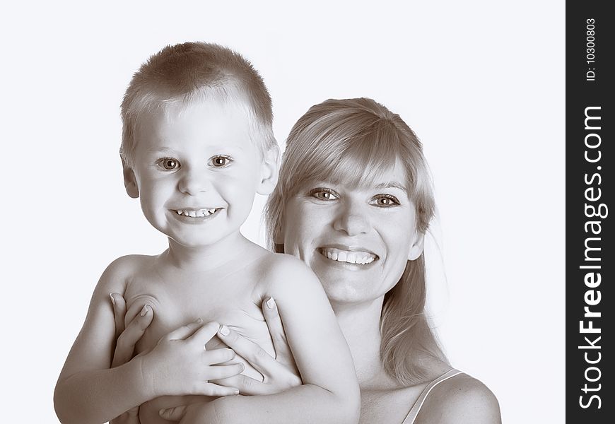 Young mum with the small son on a white background. Young mum with the small son on a white background