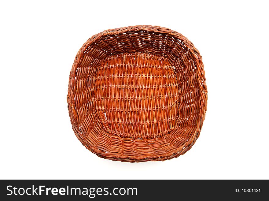 Brown wicker basket top view isolated on white background