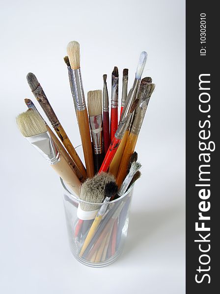 Paint brushes in glass container