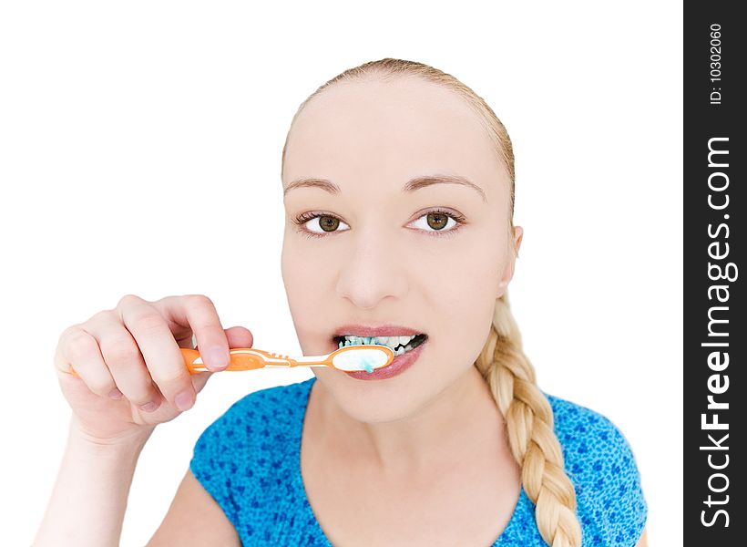 Beautiful young girl brushing teeth - on white background
