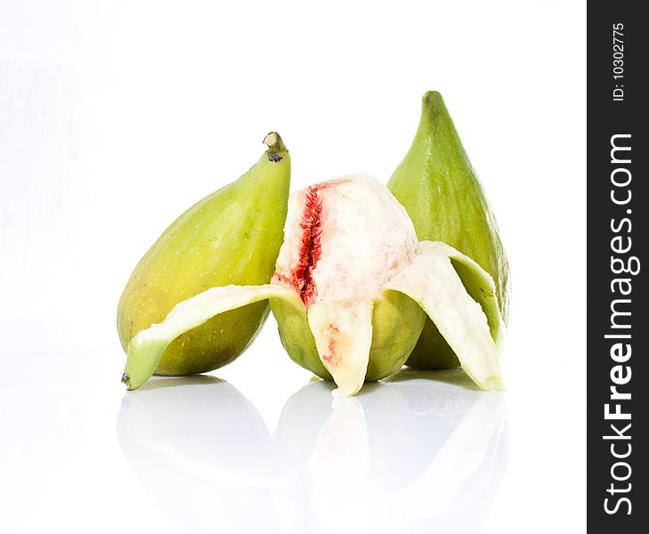 Pealed fig fruit on white backround