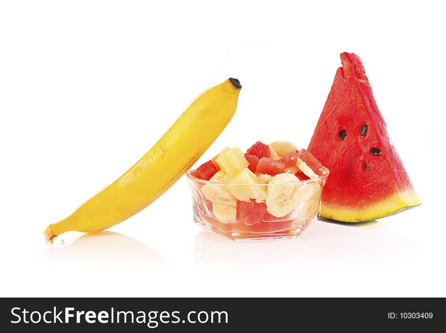 Fresh summer fruit salad on white backround