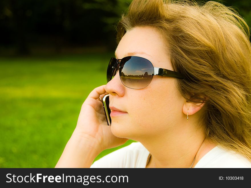 Pretty young girl talking on mobile phone. Pretty young girl talking on mobile phone
