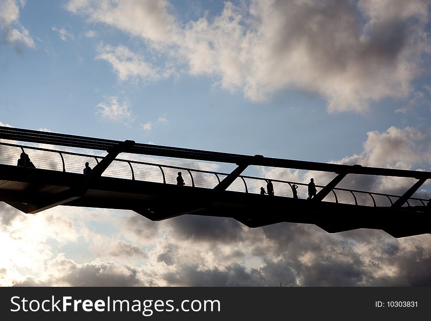 Shadows of people on a high bridge. Shadows of people on a high bridge