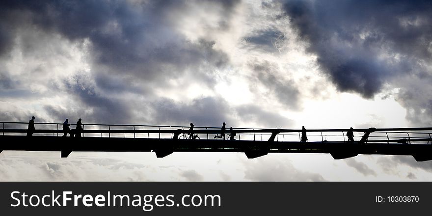 Shadows of people on a high bridge. Shadows of people on a high bridge