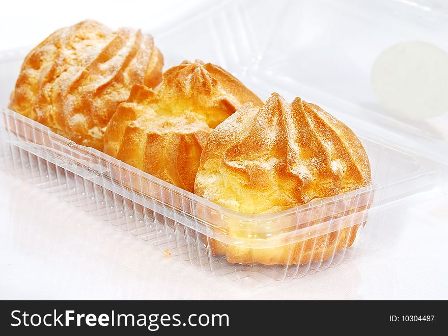 Home made cream puff in transparent container. Home made cream puff in transparent container