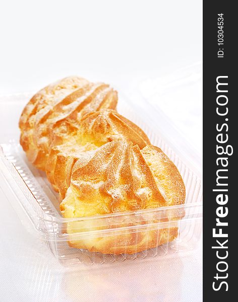 Home made cream puff in transparent container. Home made cream puff in transparent container