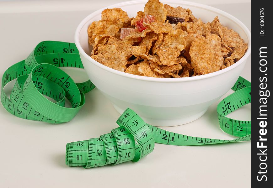 Measurement Tape Wrapped Around Dish With Flakes