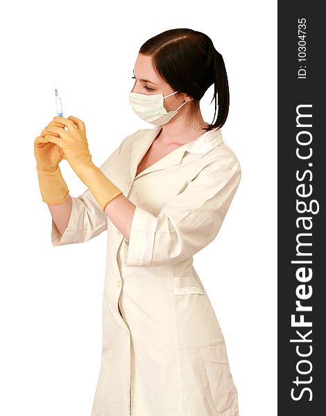 Doctor in a white robe and a mask with syringe