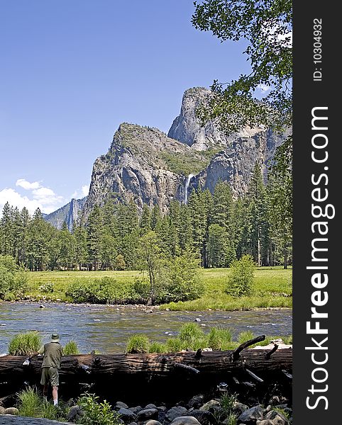 View of Yosemite Valley with a River in the foreground and Mountains in the background. View of Yosemite Valley with a River in the foreground and Mountains in the background