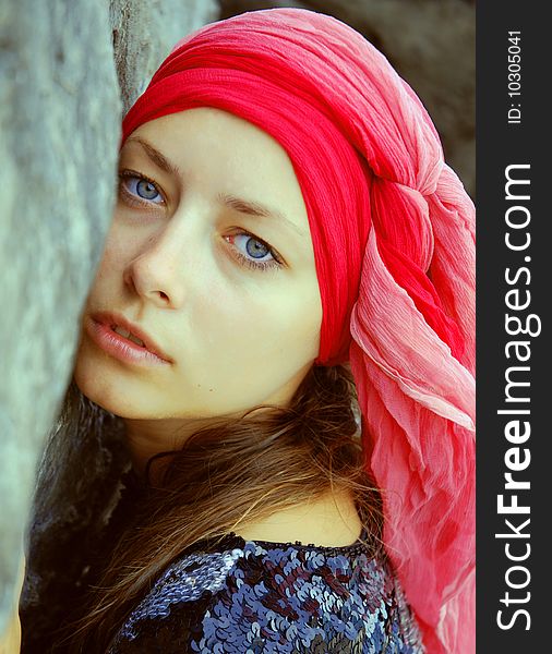 Portrait of lovely woman in red scarf