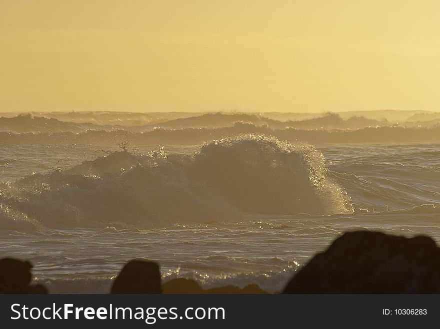 Waves in the soft light of sunset. Waves in the soft light of sunset