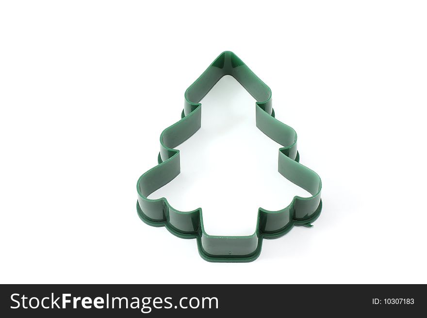 Christmas tree cookie cutter on a white background.