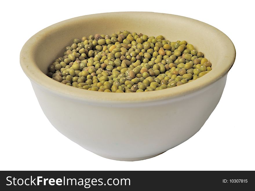 Dry split peas in ceramic bowl isolated over white