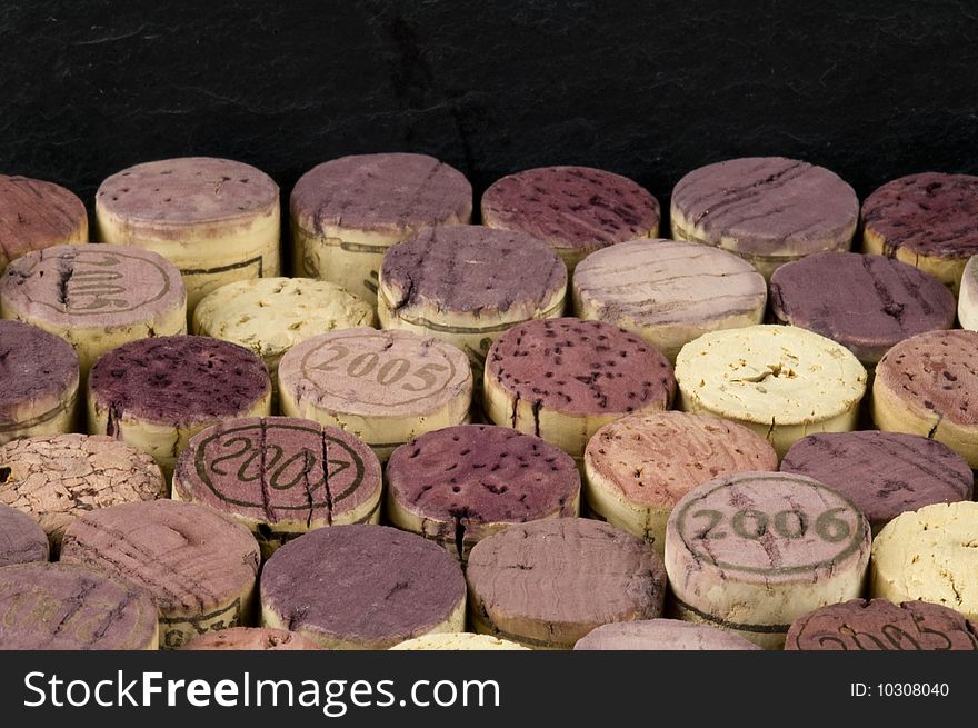 Background, wine corks in lower two thirds, slate in top frame. Background, wine corks in lower two thirds, slate in top frame.