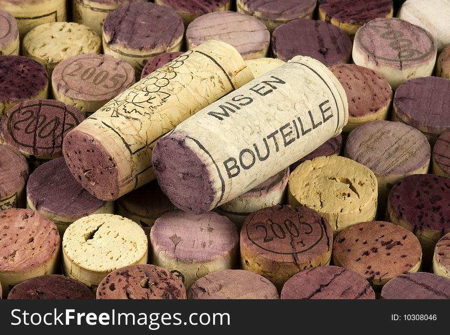 Mis en bouteille printed cork on a background of wine stoppers.