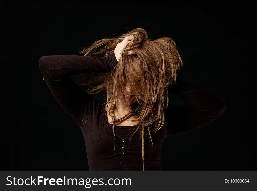 Hair flick against black background. Hair flick against black background