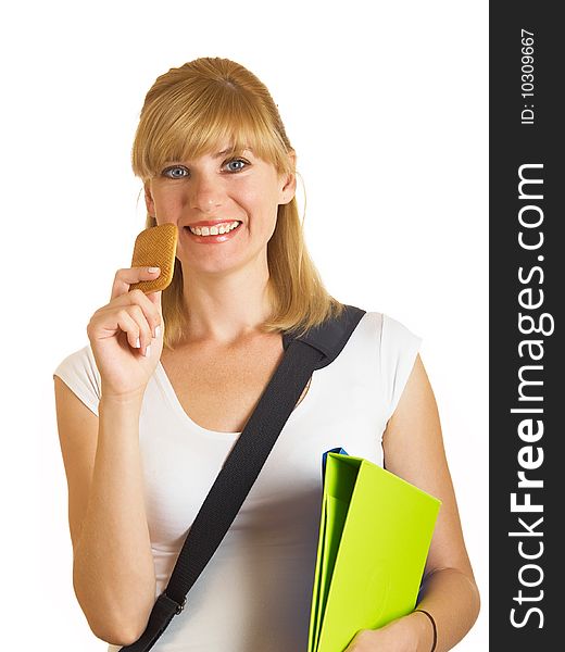 The young student is cookies on a white background. The young student is cookies on a white background