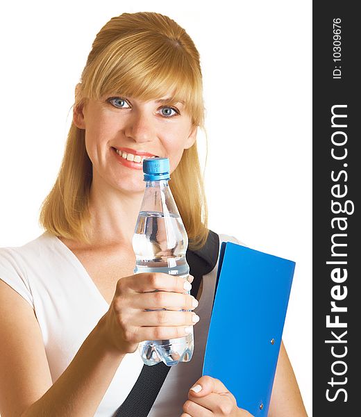 The young student holds a bottle with water on a white background. The young student holds a bottle with water on a white background