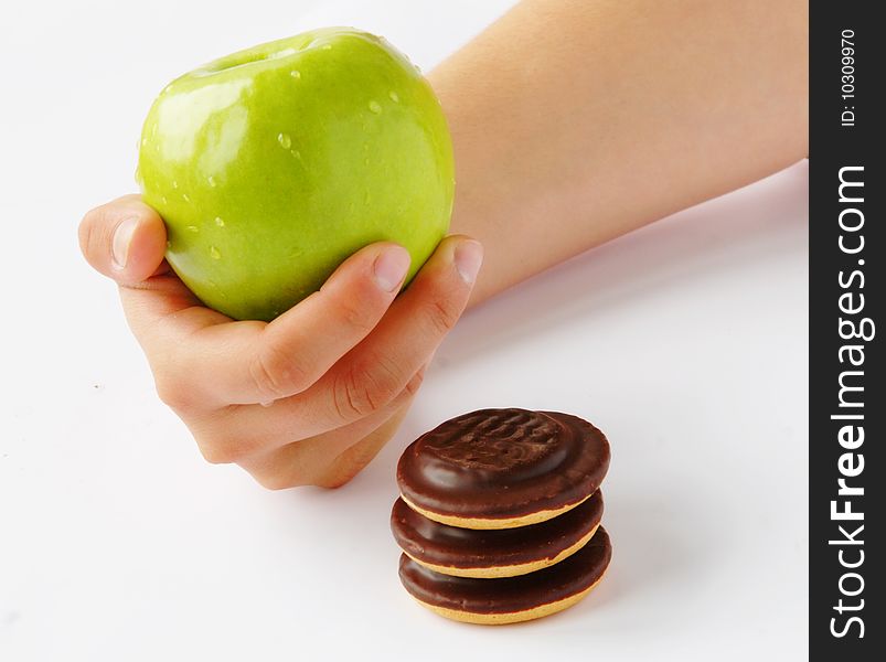 Healthy lifestyle - choosing between apple and cookie