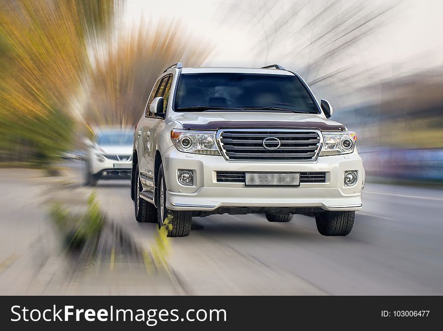 Toyota Land Cruiser on a blurred background in motion. Toyota Land Cruiser on a blurred background in motion.