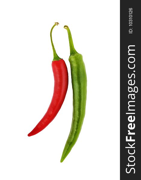 Red and green hot chili peppers on white
