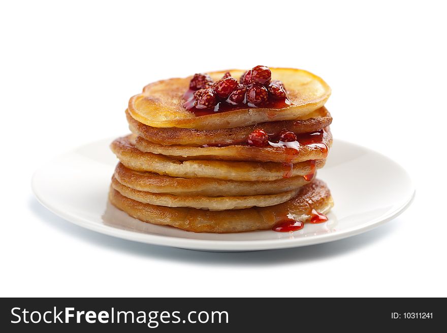 Sweet pancakes with strawberry jam isolated