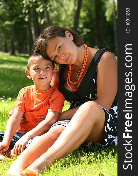 Mother with son relaxing in the park. Mother with son relaxing in the park