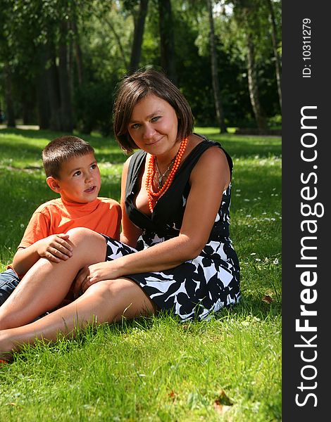 Mother with son relaxing in the park. Mother with son relaxing in the park