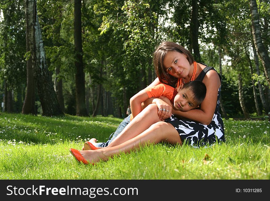 Mother with son relaxing in the park. Mother with son relaxing in the park