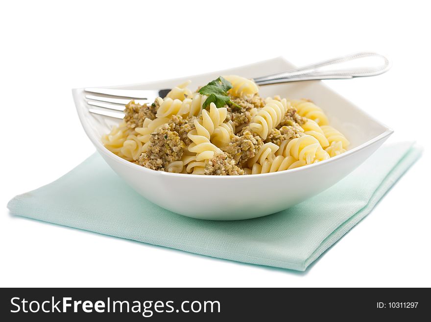 Pasta with meat and vegetables isolated over white